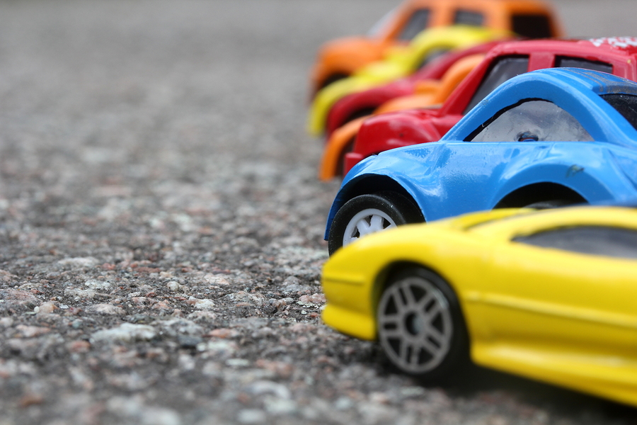 Miniature Colorful Cars Standing In Line On Road Sale Concept. D